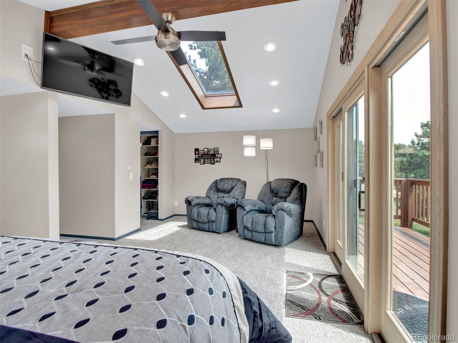 651 Lindsey Road Golden, CO 80401 - Photo 11 of 40 a bedroom with furniture and a large window