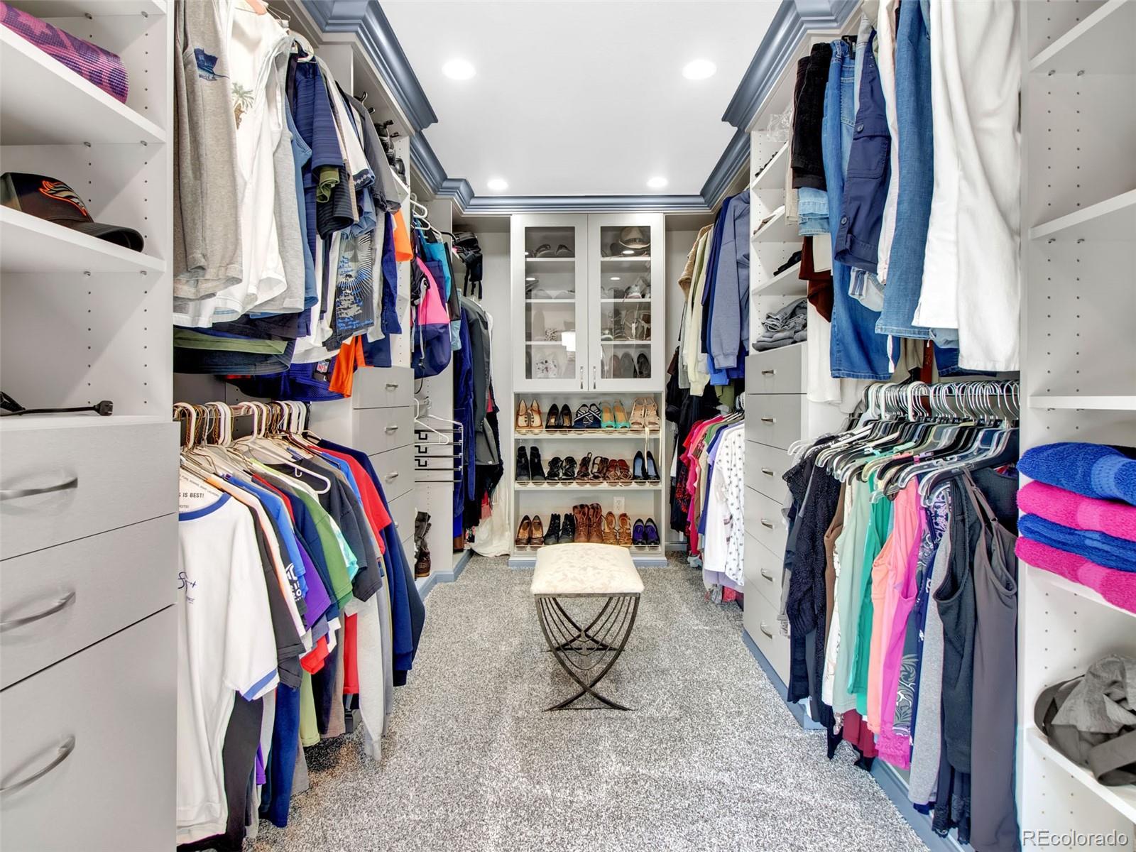 651 Lindsey Road Golden, CO 80401 - Photo 14 of 40 a view of walk in closet with clothes and shoes