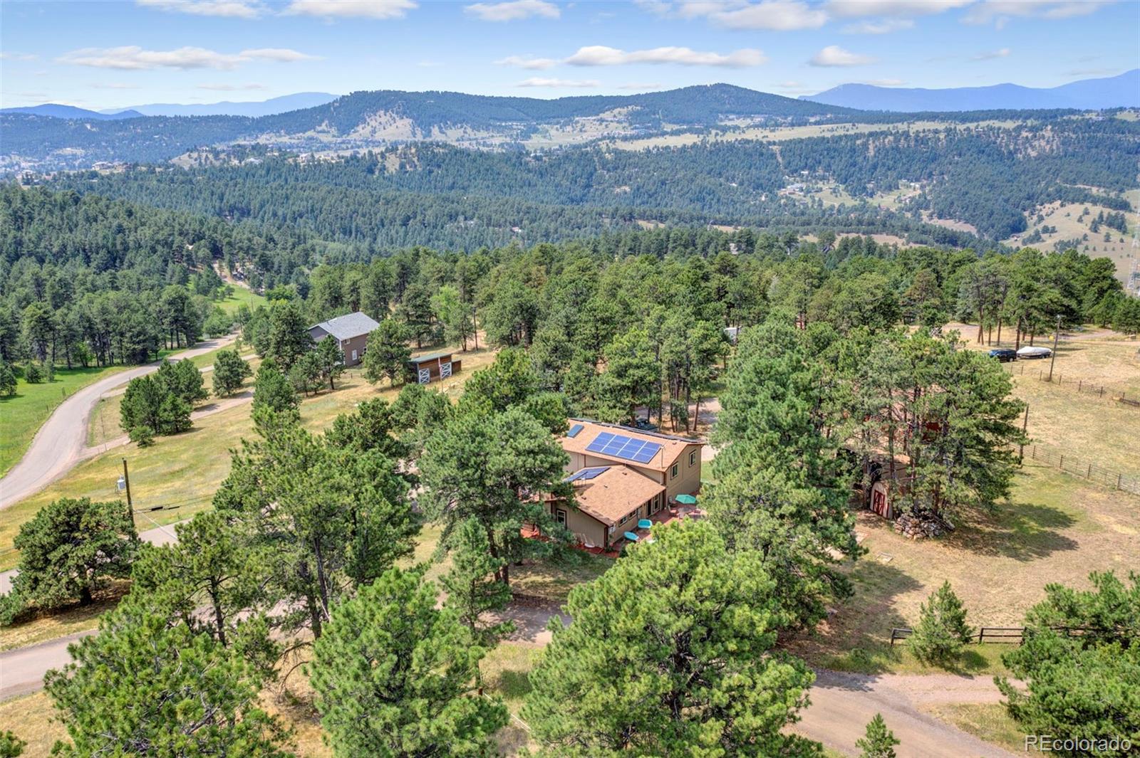651 Lindsey Road Golden, CO 80401 - Photo 2 of 40 a view of a town with mountains in the background