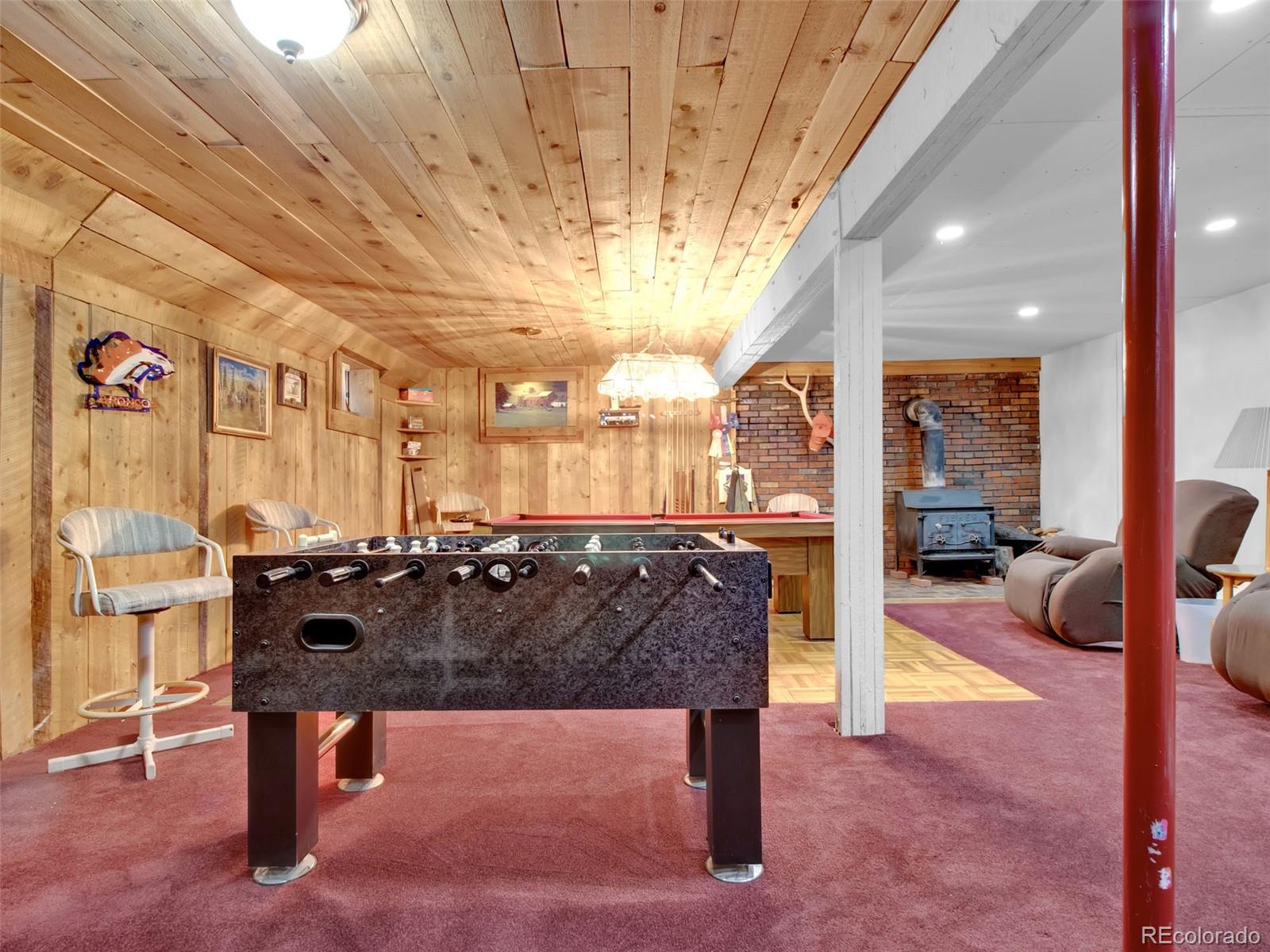 651 Lindsey Road Golden, CO 80401 - Photo 21 of 40 a view of living room with furniture and a chandelier