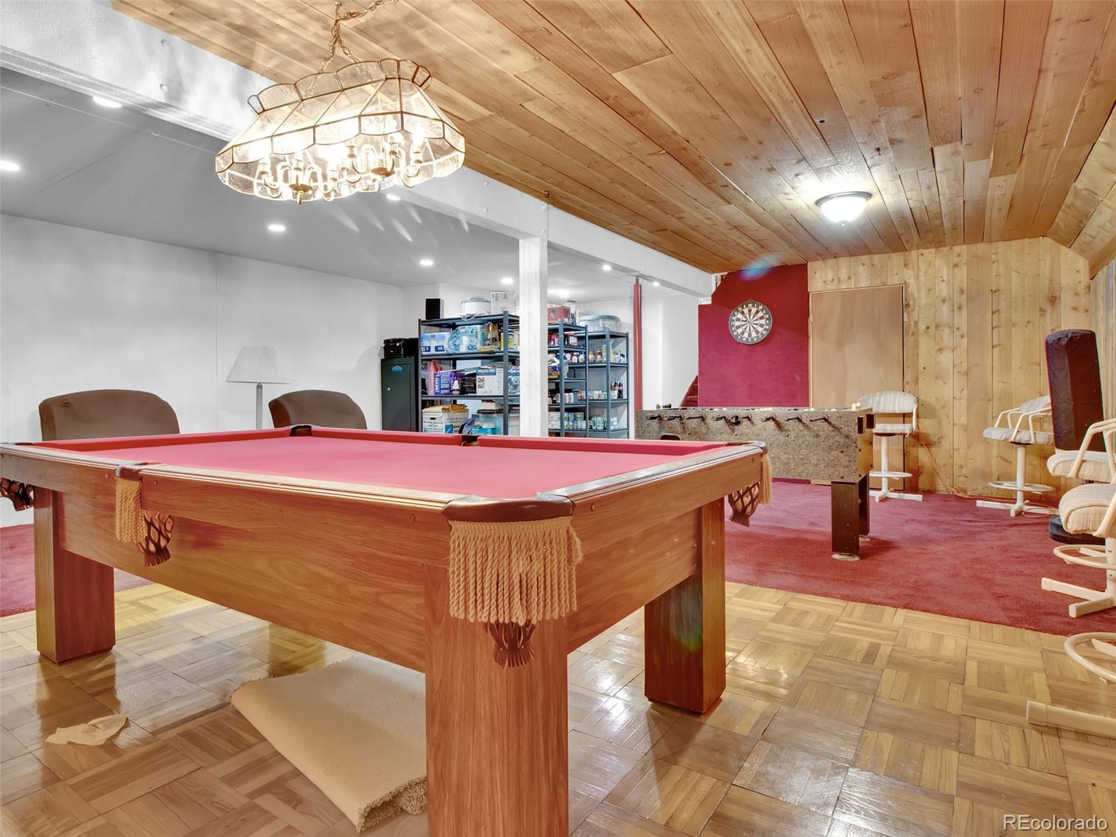 651 Lindsey Road Golden, CO 80401 - Photo 23 of 40 a room with table chairs and a chandelier