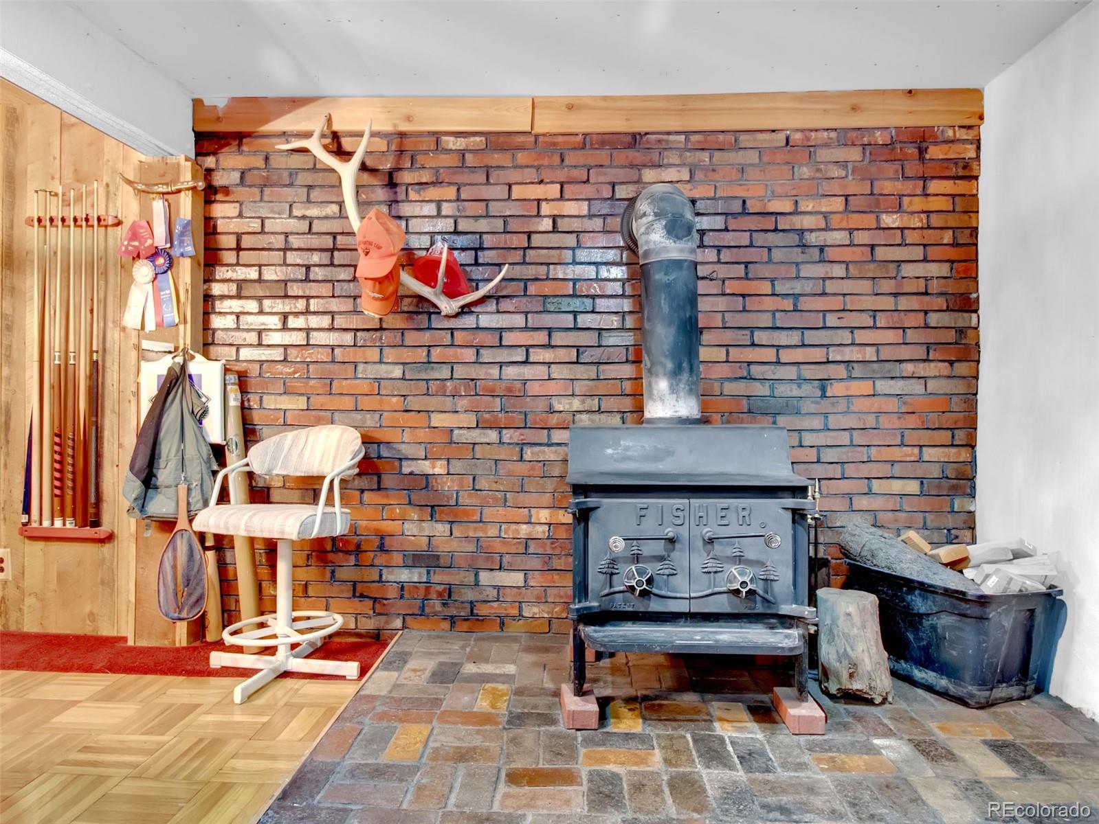 651 Lindsey Road Golden, CO 80401 - Photo 24 of 40 a building with glass door shower and couches