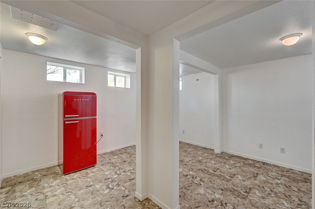 629 L Avenue Boulder City, NV 89005 - Photo 34 of 46 Basement featuring freestanding refrigerator and a textured ceiling
