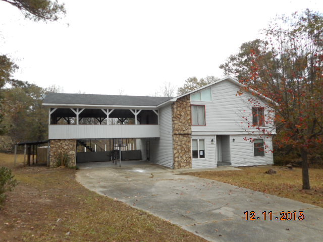 7331 Quail Run Road Lizella, GA 31052 - Photo 1 of 23 a view of a house with a yard and garage
