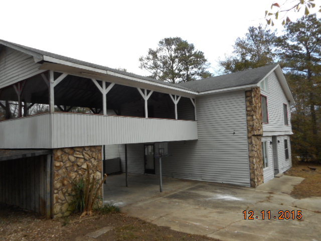 7331 Quail Run Road Lizella, GA 31052 - Photo 2 of 23 a view of a house with a balcony