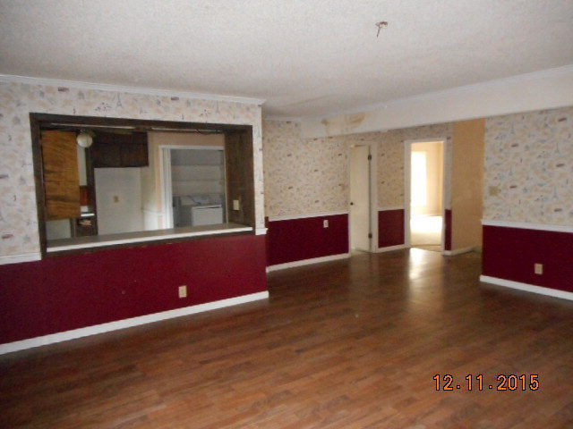 7331 Quail Run Road Lizella, GA 31052 - Photo 11 of 23 a view of livingroom with furniture wooden floor and windows