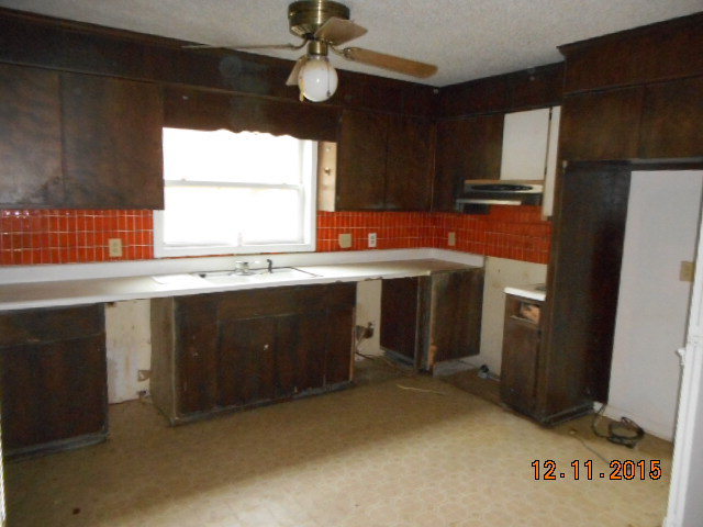 7331 Quail Run Road Lizella, GA 31052 - Photo 12 of 23 a kitchen with stainless steel appliances granite countertop a sink a stove and a refrigerator