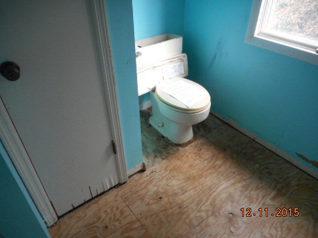 7331 Quail Run Road Lizella, GA 31052 - Photo 21 of 23 a bathroom with a toilet and a vanity