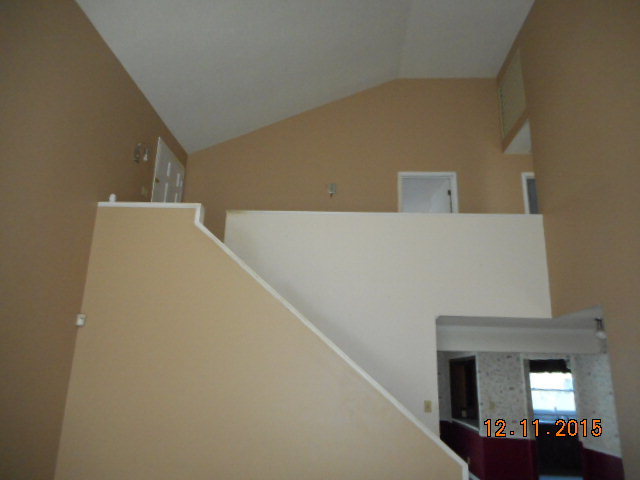 7331 Quail Run Road Lizella, GA 31052 - Photo 9 of 23 a view of a hallway with wooden floor