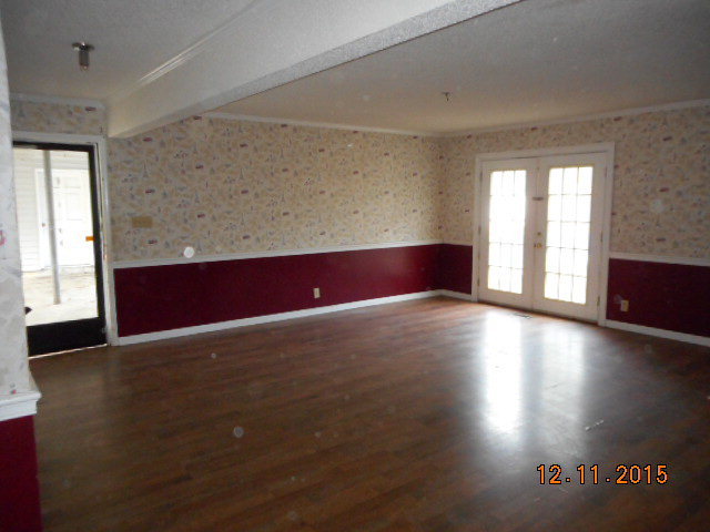 7331 Quail Run Road Lizella, GA 31052 - Photo 10 of 23 an empty room with wooden floor and windows
