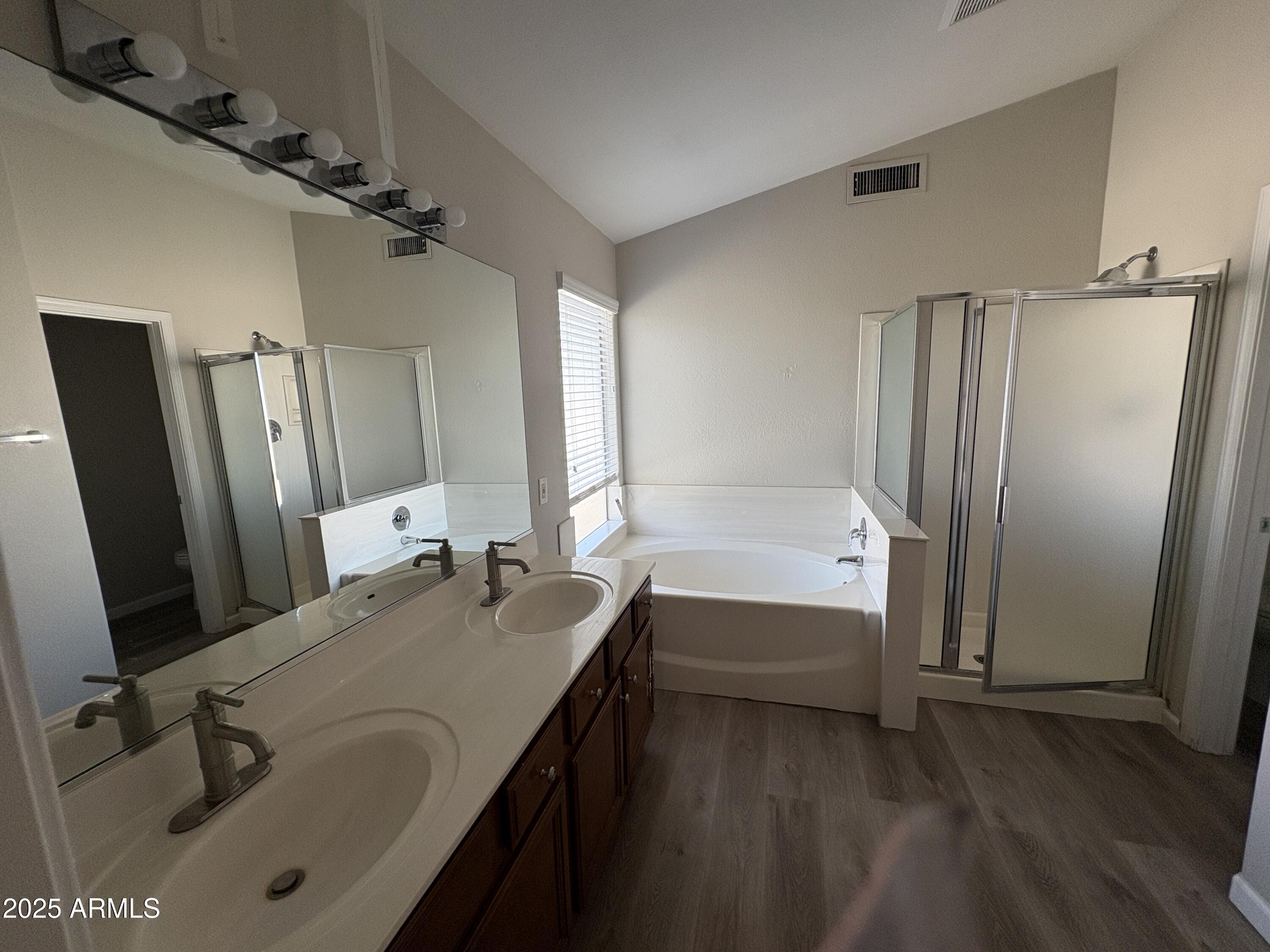 1472 East Constitution Drive Chandler, AZ 85225 - Photo 18 of 27 a bathroom with a tub sink and a mirror
