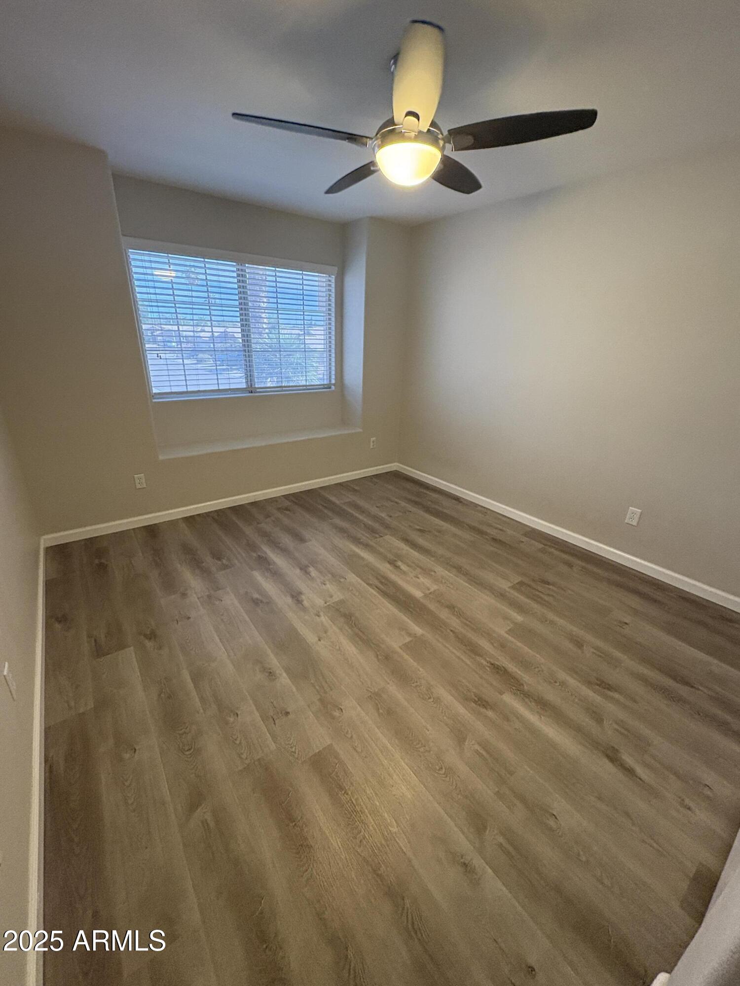 1472 East Constitution Drive Chandler, AZ 85225 - Photo 22 of 27 an empty room with windows and fan