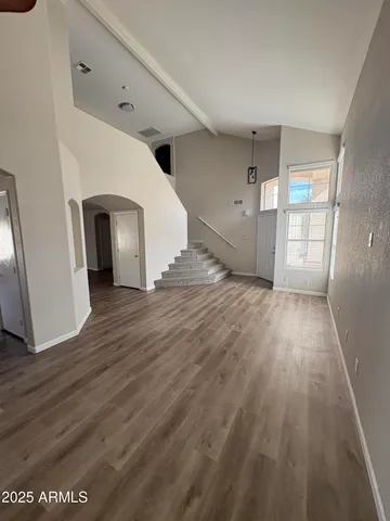 a view of a hallway with wooden floor