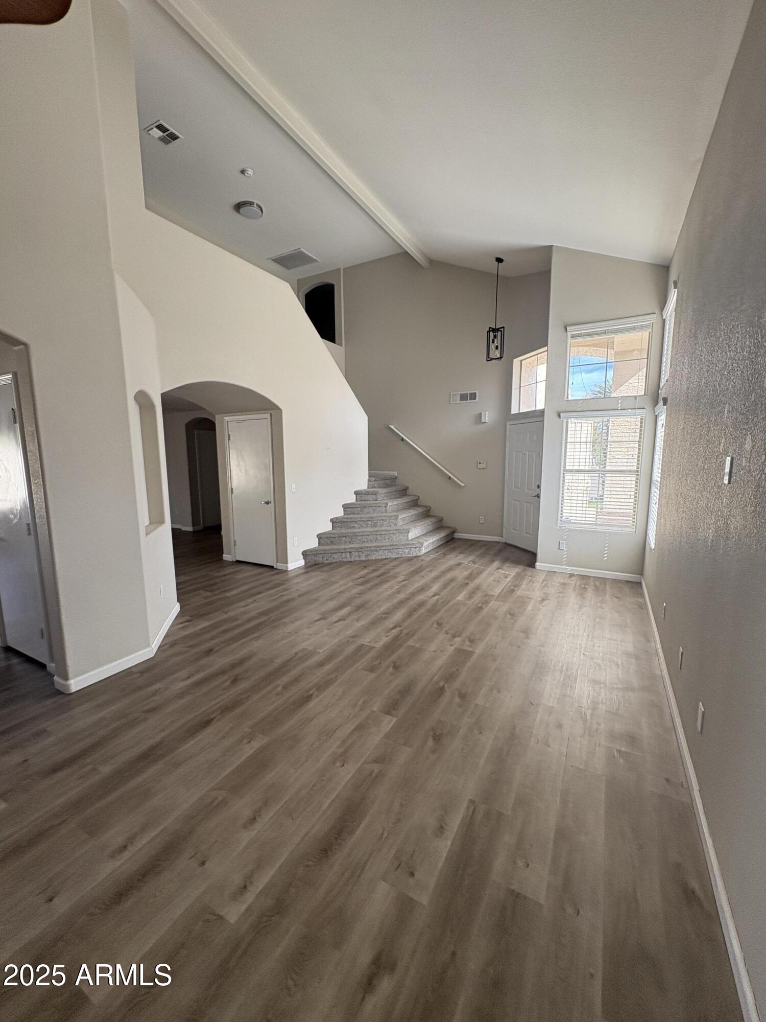 1472 East Constitution Drive Chandler, AZ 85225 - Photo 8 of 27 a view of a hallway with wooden floor
