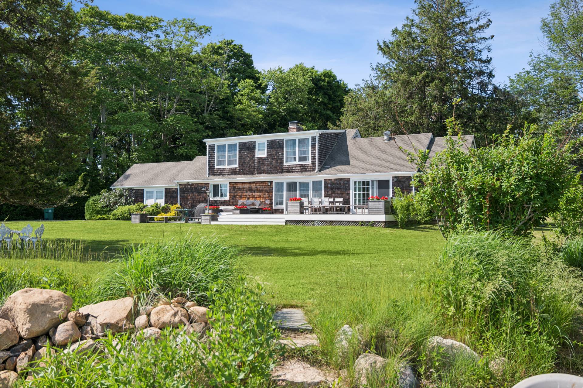 69 Ferry Road Sag Harbor, NY 11963 - Photo 17 of 17 a front view of house with yard and green space