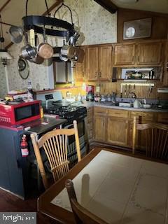 50-52 Trolley Road Pequea, PA 17565 - Photo 5 of 9 a kitchen with stainless steel appliances granite countertop a stove a sink and a microwave