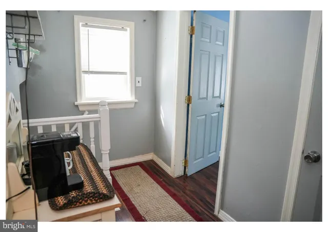 a view of a hallway with workspace