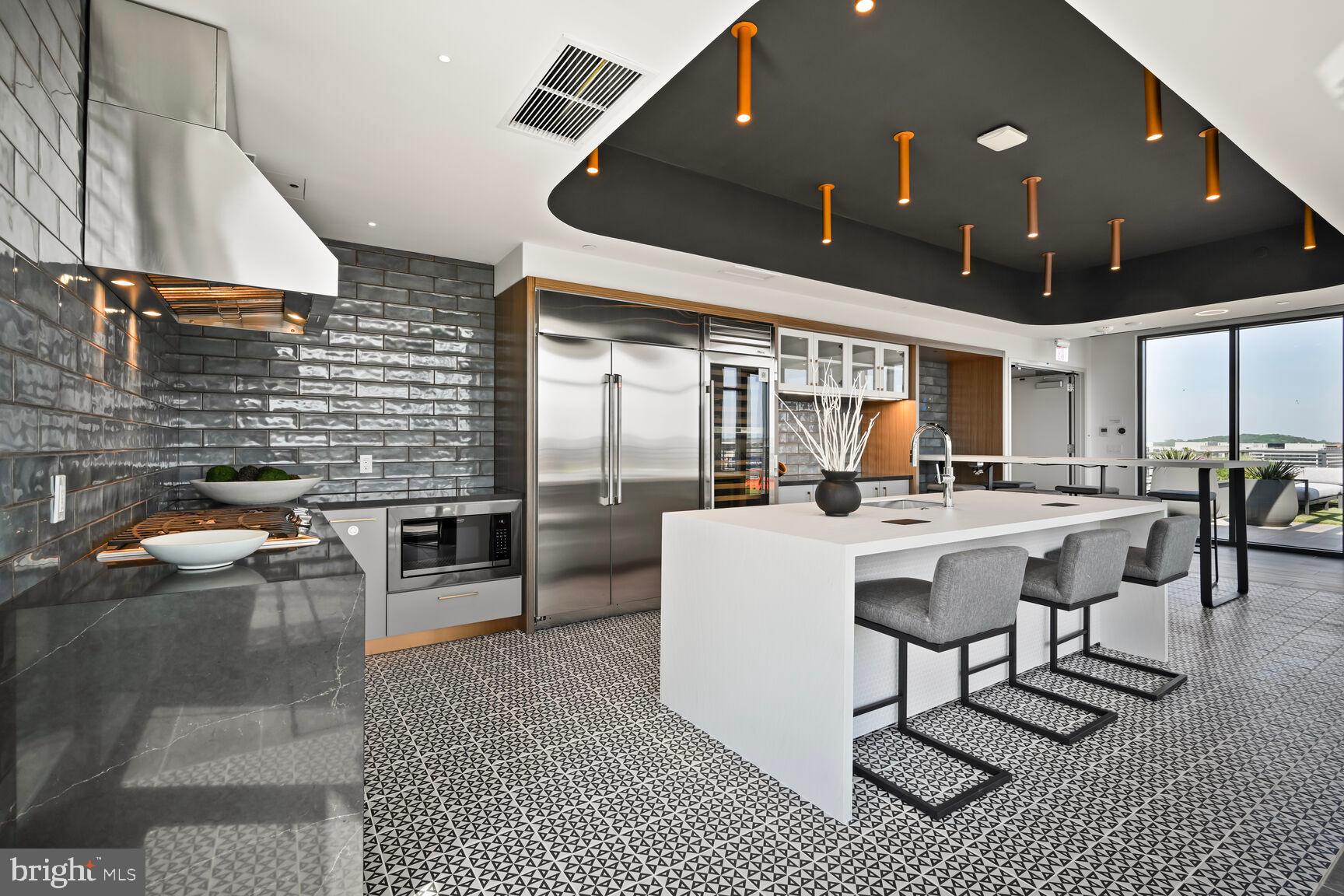 950 3rd Street Northwest, Unit 702 Washington, DC 20001 - Photo 15 of 31 a living room with furniture a dining table and kitchen view