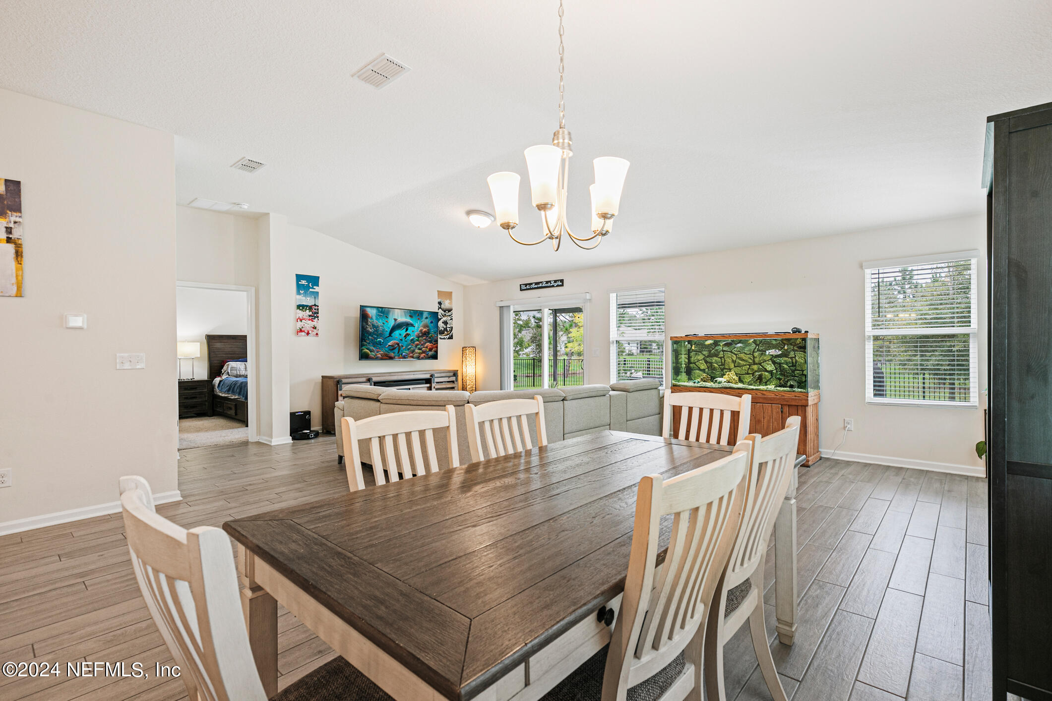 340 Chasewood Drive St. Augustine, FL 32095 - Photo 12 of 46 a view of a dining room with furniture window and wooden floor