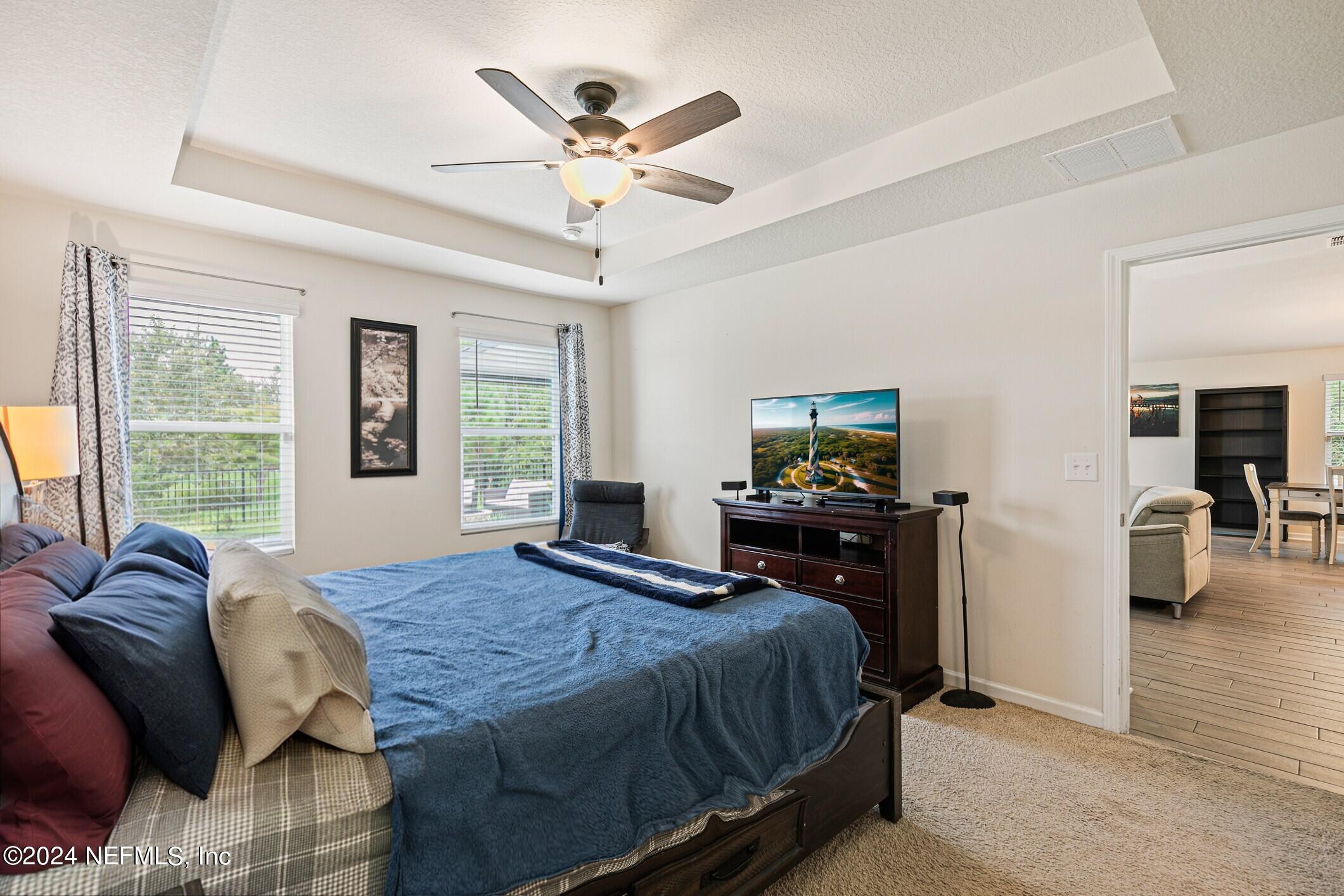340 Chasewood Drive St. Augustine, FL 32095 - Photo 20 of 46 a bedroom with a bed and wooden floor