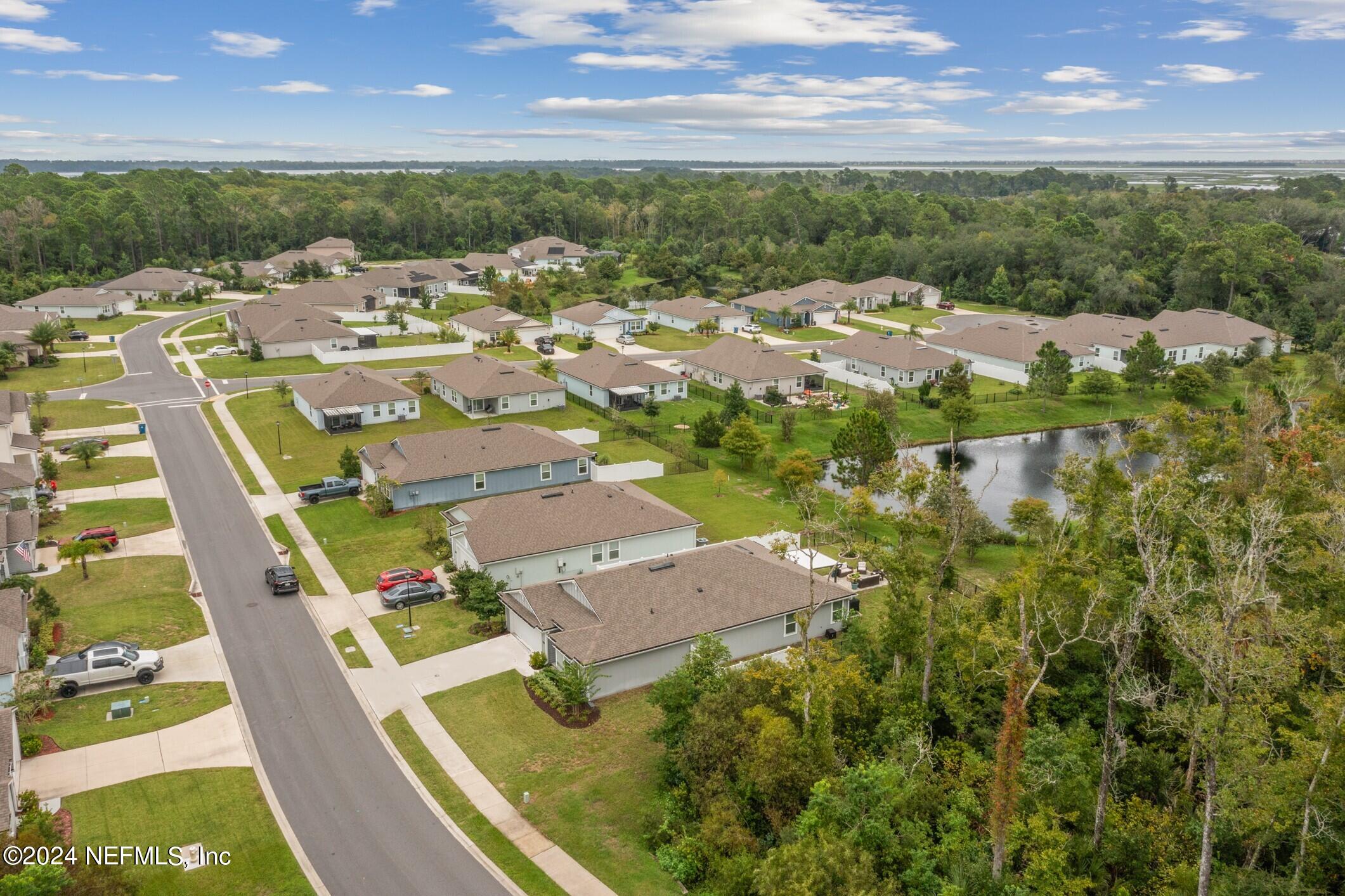 340 Chasewood Drive St. Augustine, FL 32095 - Photo 42 of 46 an aerial view of residential houses with outdoor space and trees