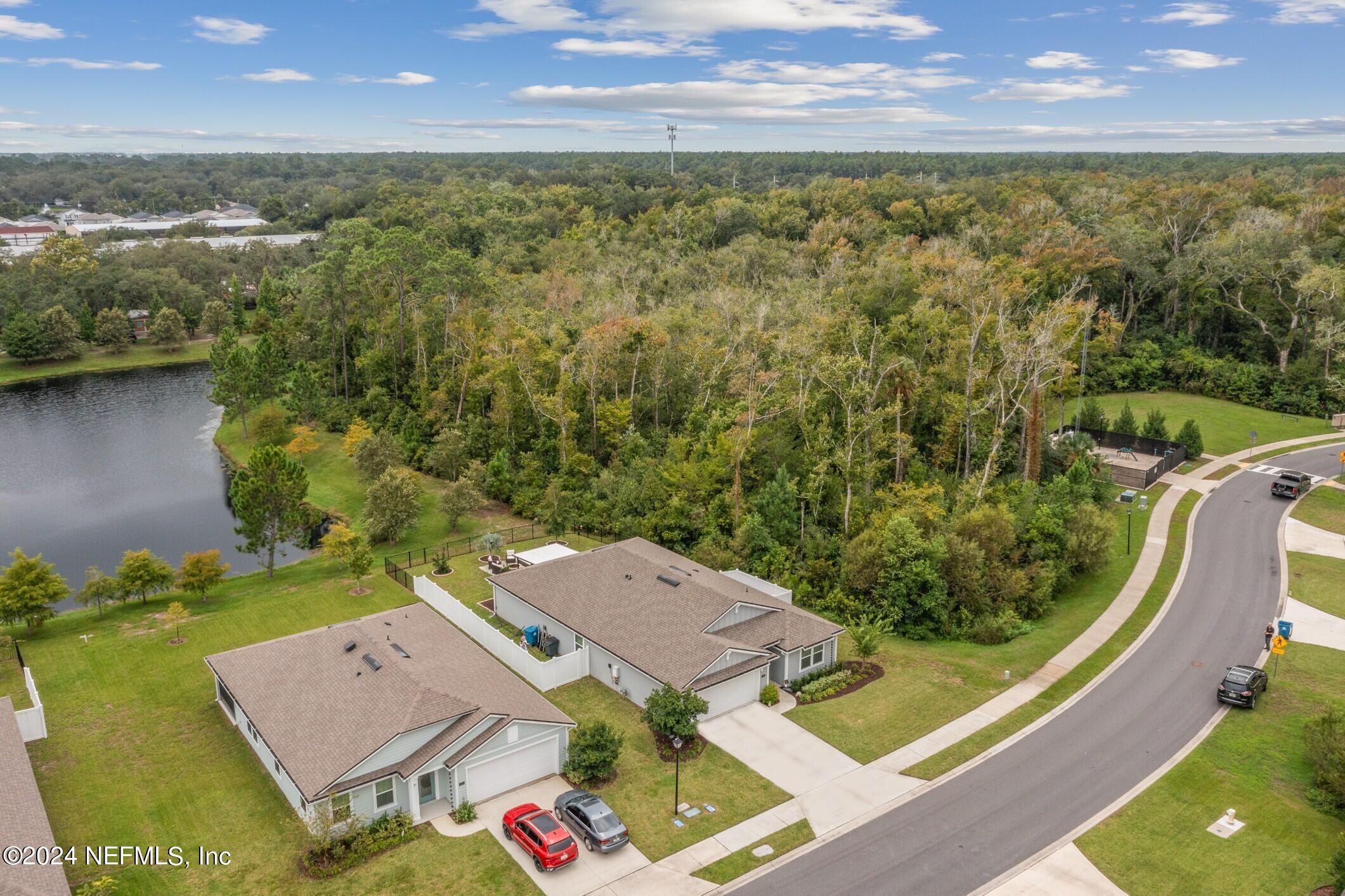 340 Chasewood Drive St. Augustine, FL 32095 - Photo 44 of 46 an aerial view of residential houses with outdoor space and ocean view
