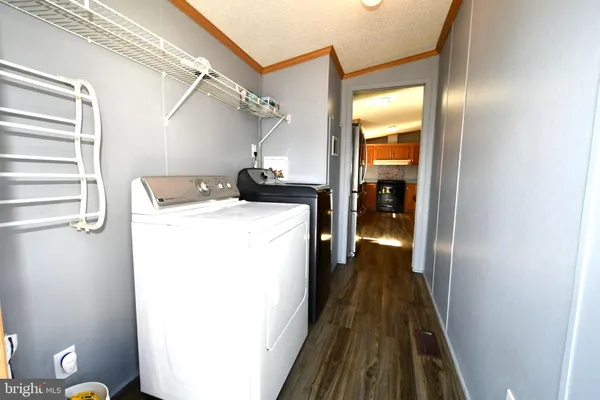 a view of hallway with washer and dryer