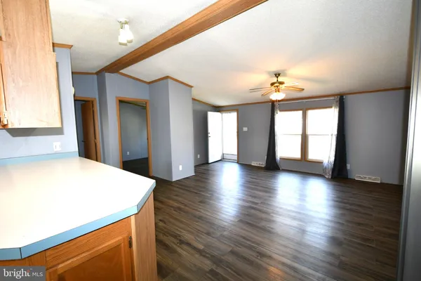 a view of a kitchen with a sink and a window