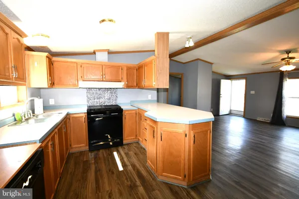 a kitchen with a refrigerator and a sink