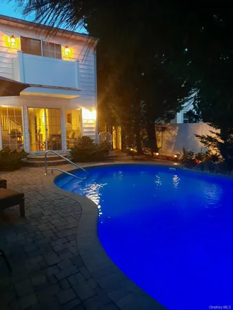 a view of swimming pool with outdoor seating