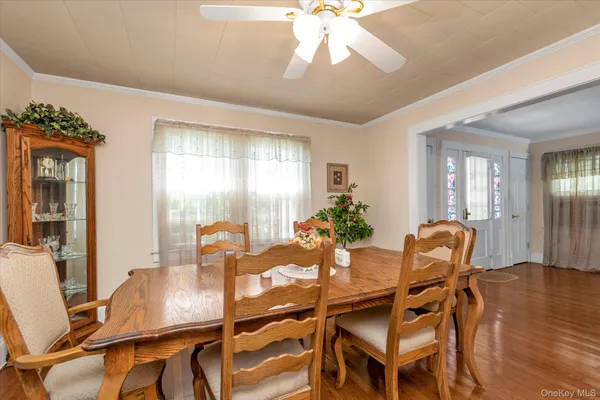 a dining room with furniture and window