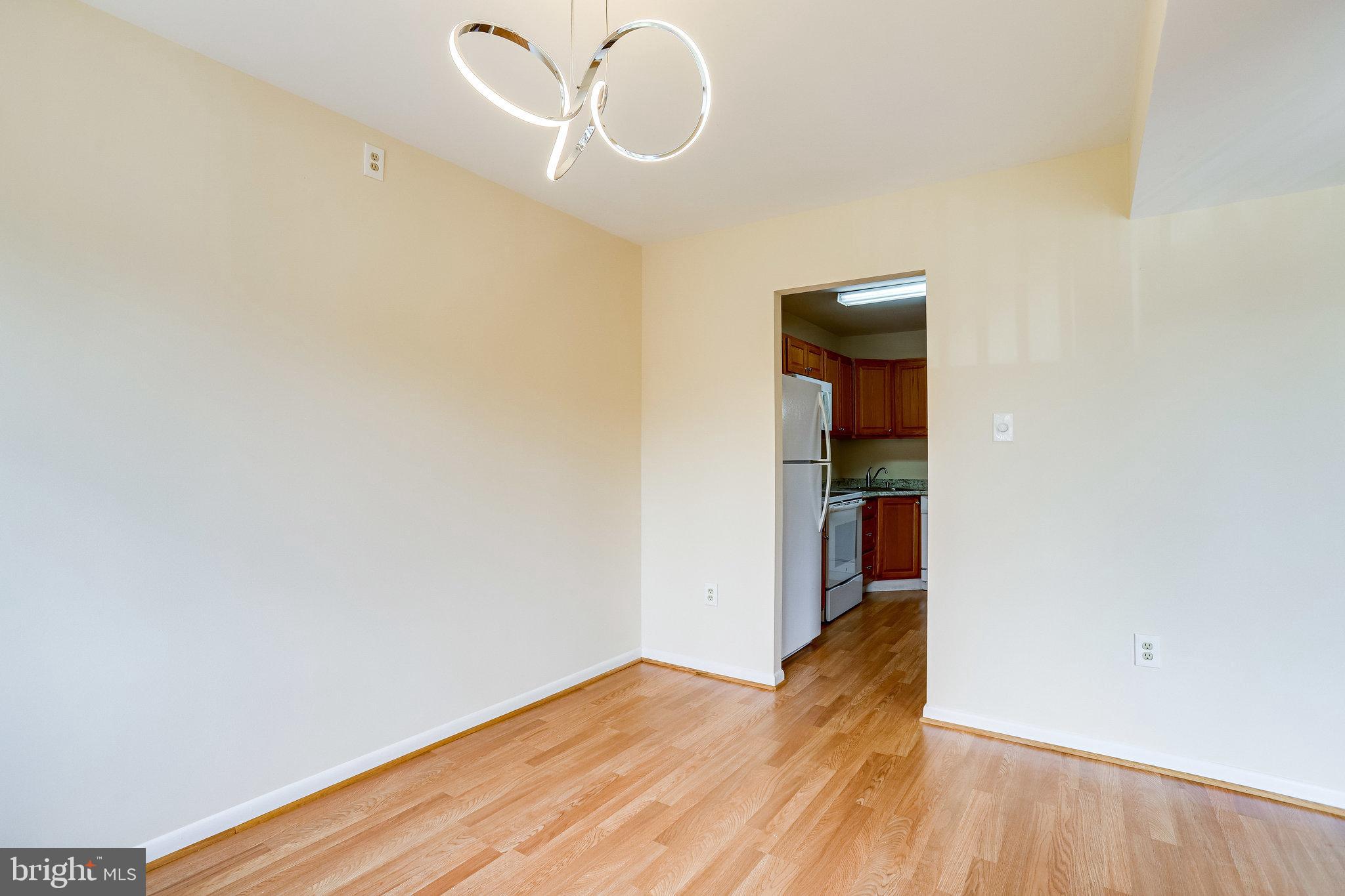 2212 Springwood Drive, Unit 206 Reston, VA 20191 - Photo 17 of 46 a view of empty room with wooden floor