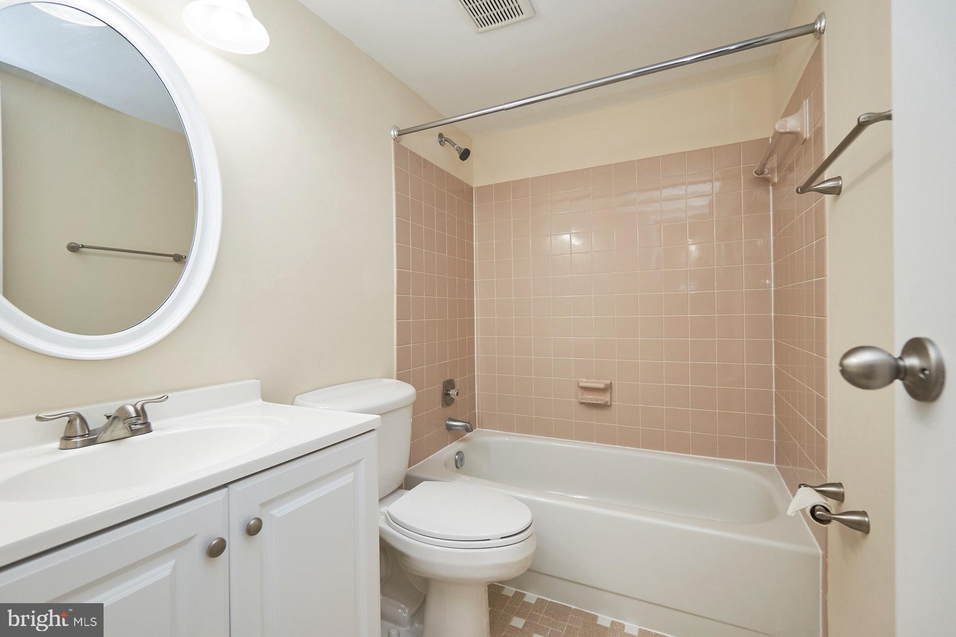2212 Springwood Drive, Unit 206 Reston, VA 20191 - Photo 34 of 46 a bathroom with a sink toilet and shower