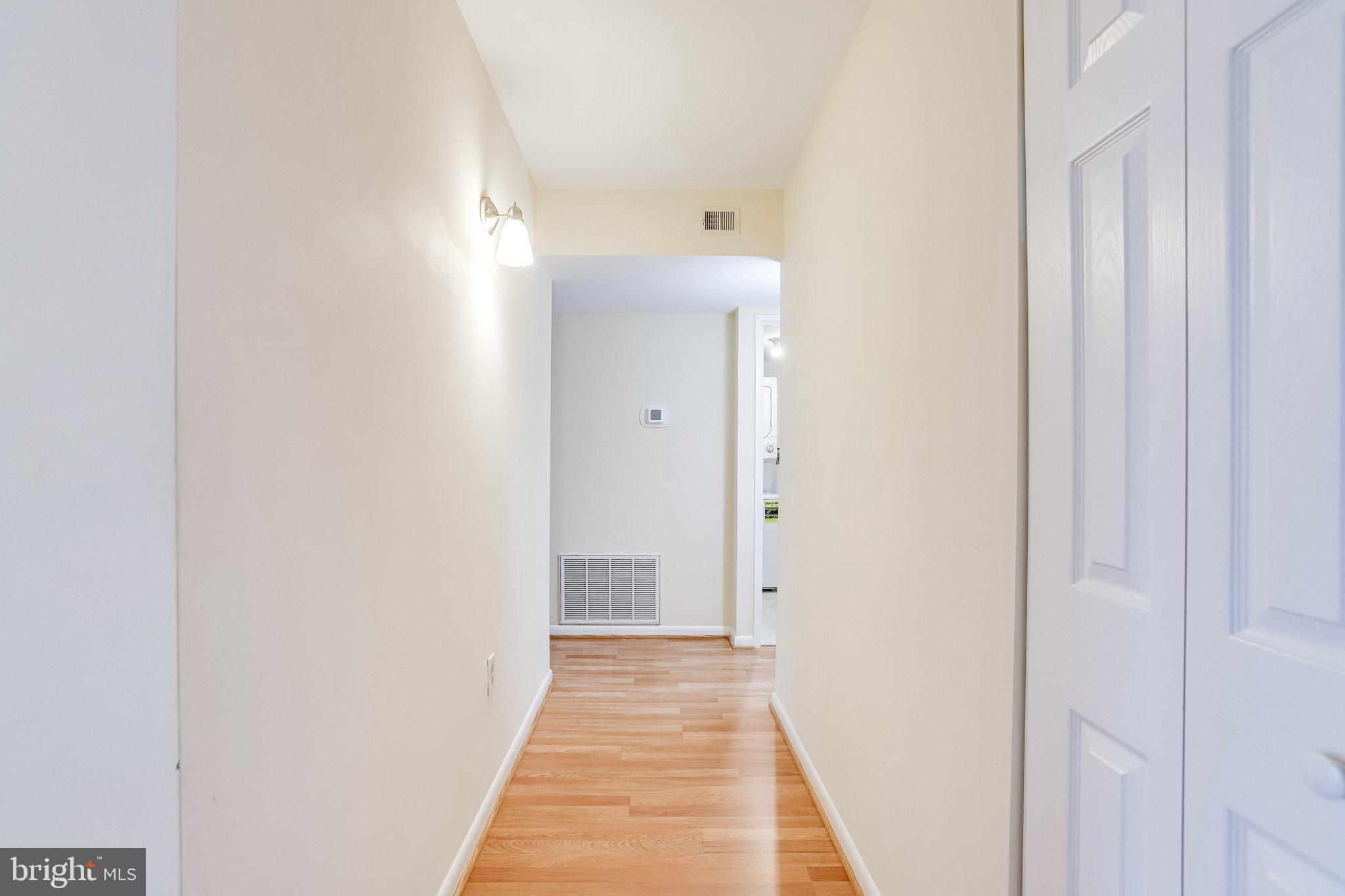 2212 Springwood Drive, Unit 206 Reston, VA 20191 - Photo 6 of 46 a view of a bathroom from the hallway