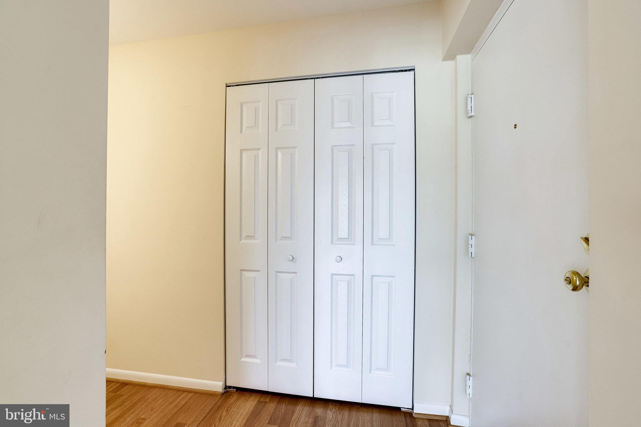 2212 Springwood Drive, Unit 206 Reston, VA 20191 - Photo 7 of 46 a view of a hallway with wooden floor
