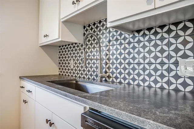a kitchen with stainless steel appliances granite countertop a stove and a sink