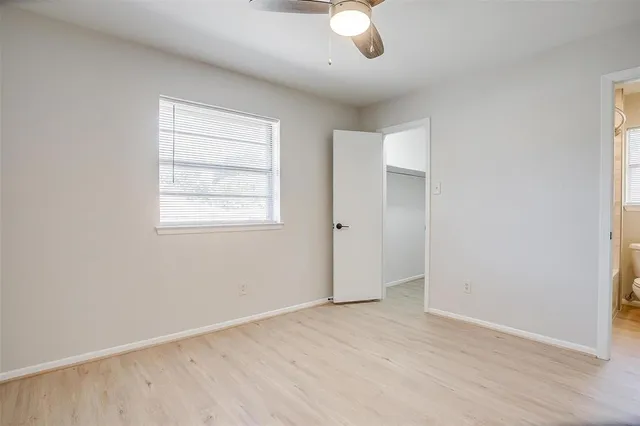 a bathroom with a toilet sink and shower