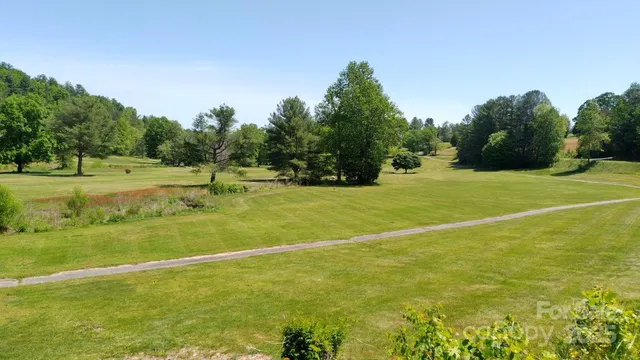 a view of a backyard with sitting area