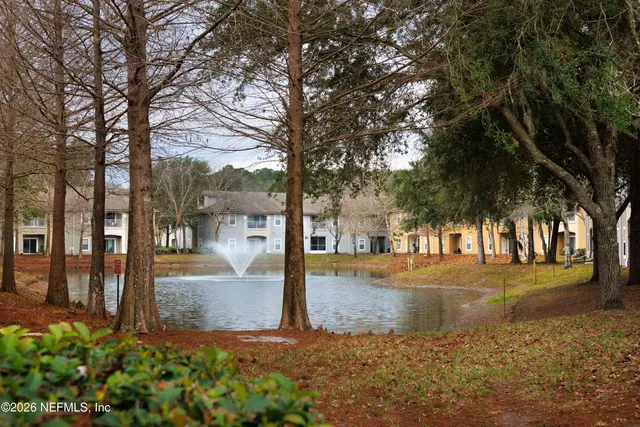 a lots of cars parked on the side of a street