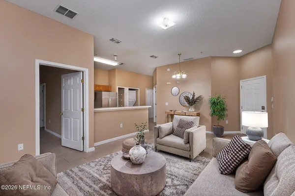 a living room with furniture and a large window