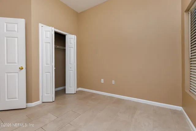 an empty room with closet area
