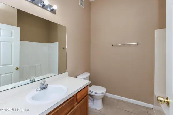 a bathroom with a sink toilet and vanity