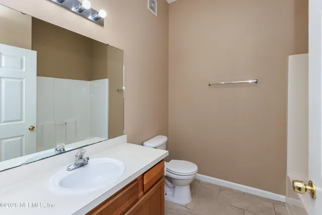 a bathroom with a sink toilet and vanity