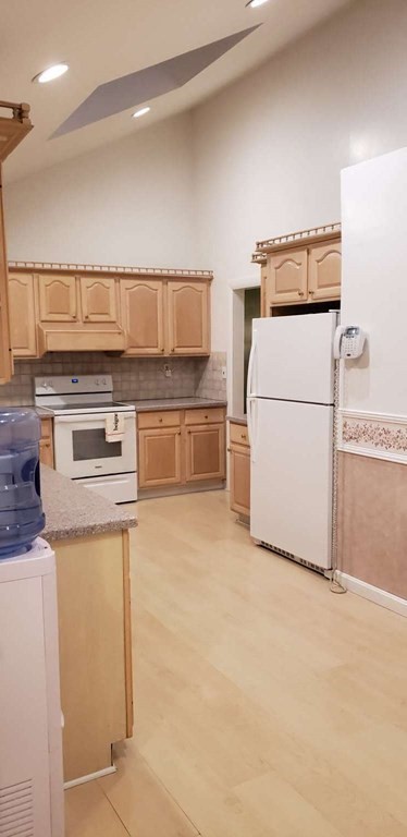 18 Davis Street Woburn, MA 01801 - Photo 13 of 20 a kitchen with a stove top oven