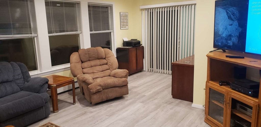 18 Davis Street Woburn, MA 01801 - Photo 14 of 20 a living room with furniture and a flat screen tv