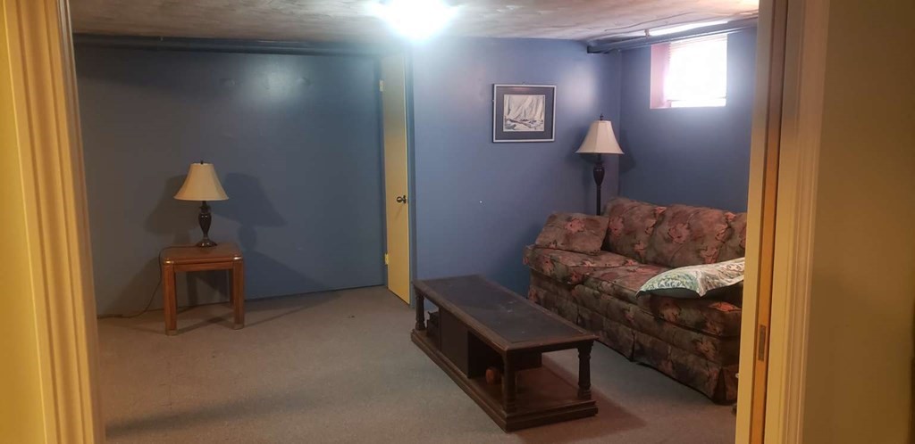 18 Davis Street Woburn, MA 01801 - Photo 16 of 20 a living room with furniture and a window
