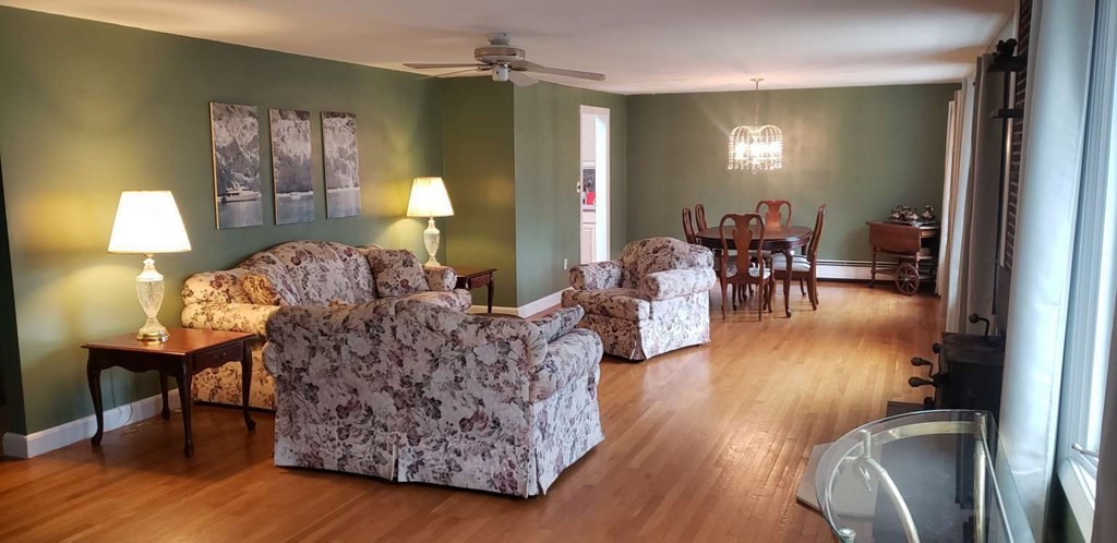 18 Davis Street Woburn, MA 01801 - Photo 2 of 20 a living room with furniture and a lamp