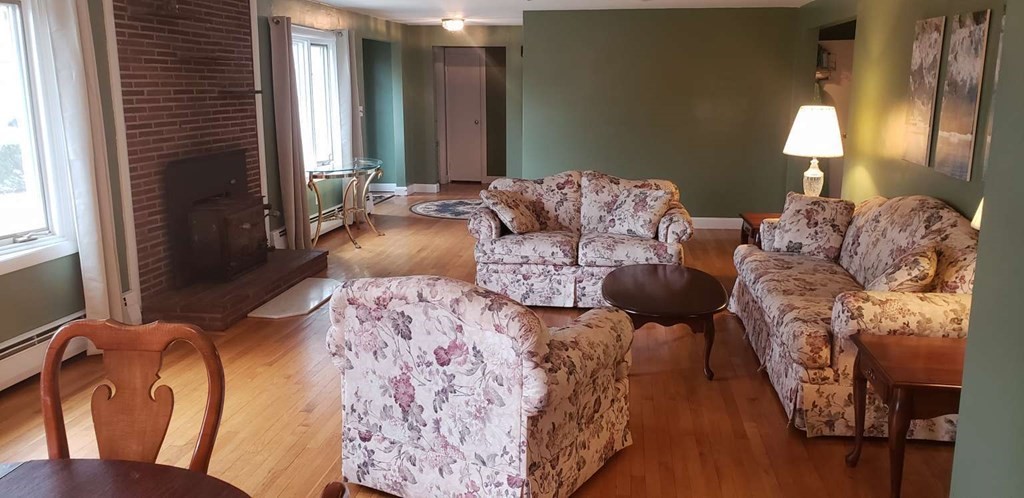 18 Davis Street Woburn, MA 01801 - Photo 3 of 20 a living room with furniture and a lamp