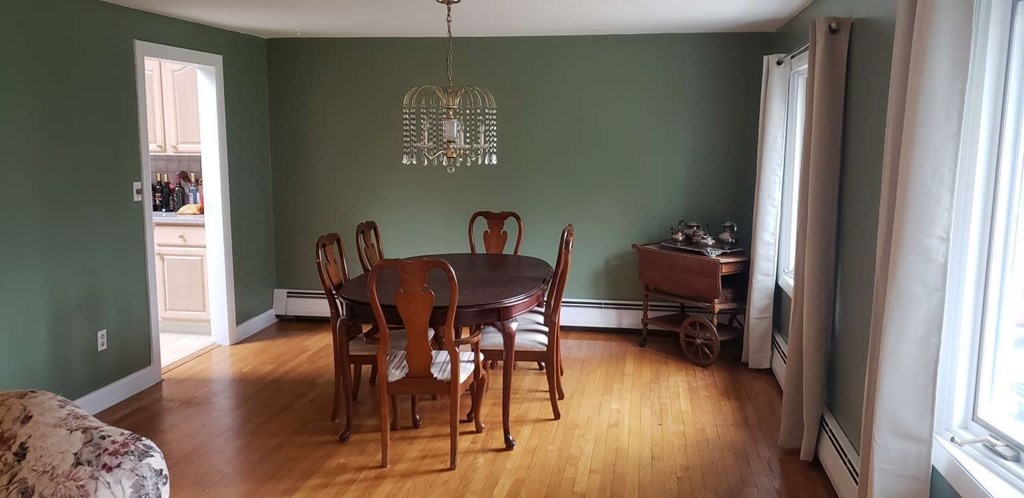 18 Davis Street Woburn, MA 01801 - Photo 4 of 20 a view of a dining room with furniture and wooden floor