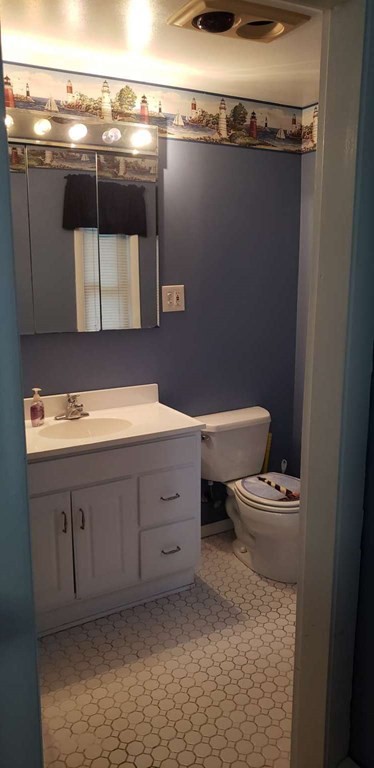 18 Davis Street Woburn, MA 01801 - Photo 7 of 20 a bathroom with a sink and a toilet